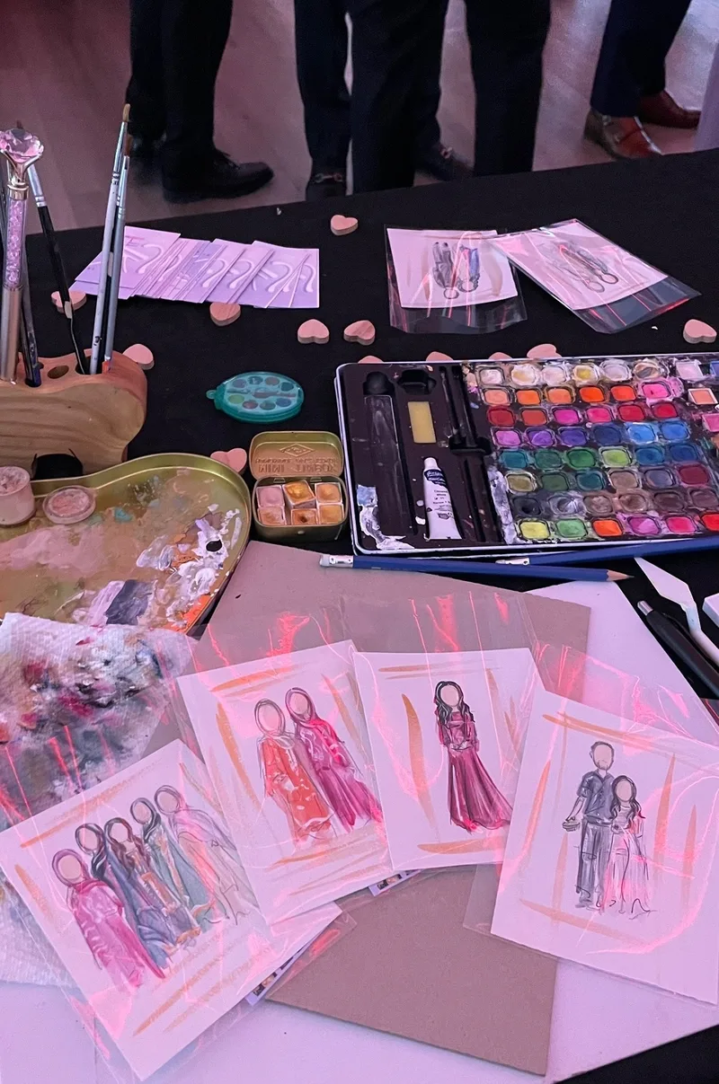 Watercolour palette and completed cultural celebration portraits